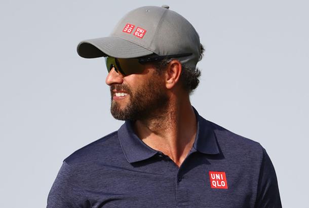 Former World No.1 and Masters champion Adam Scott wears sunglasses on the golf course.