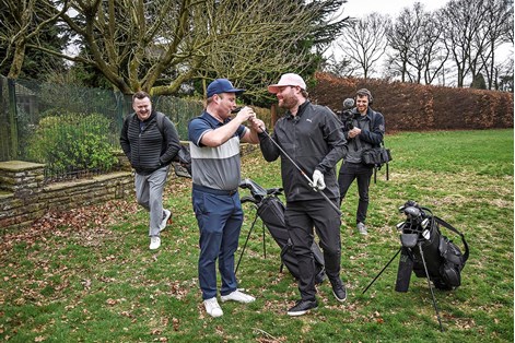 Tubes and Ange share a laugh on the golf course while filming for their YouTube channel.