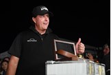 Phil Mickelson celebrates beating Tiger Woods to win $9m in The Match in 2018.