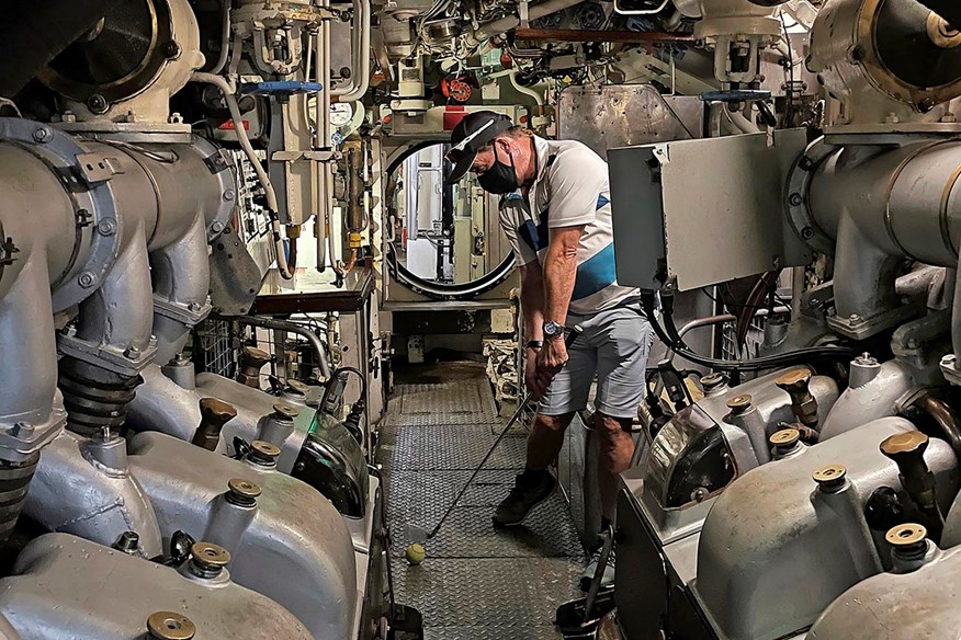 David Sullivan playing golf on a submarine