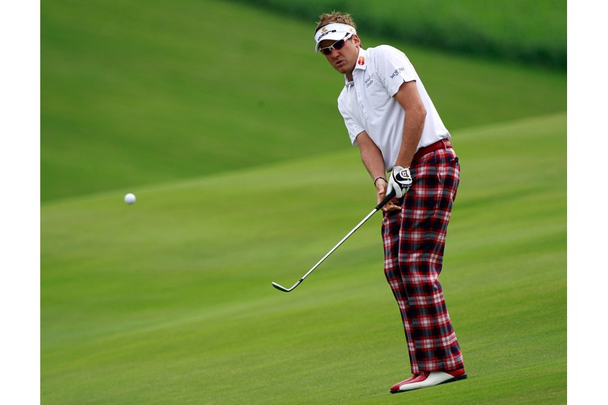 Iam Poulter wearing bright checked trousers at Wentworth