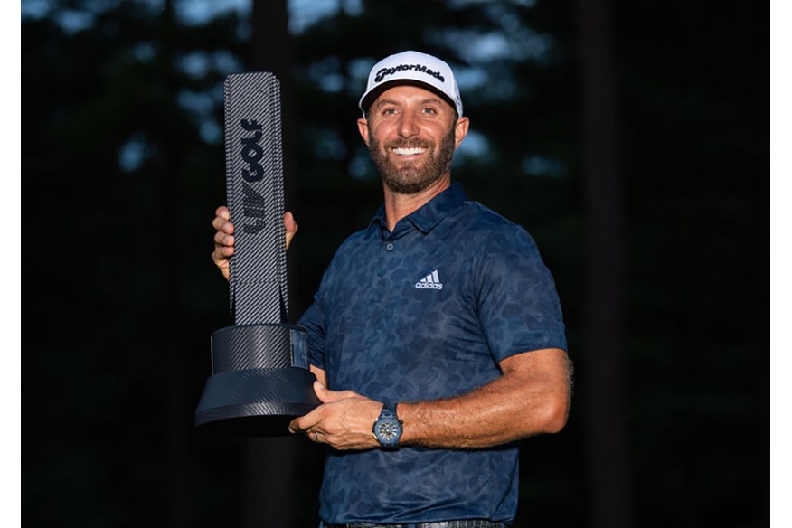 Dustin Johnson poses with the trophy after winning the LIV Golf Invitational Boston.