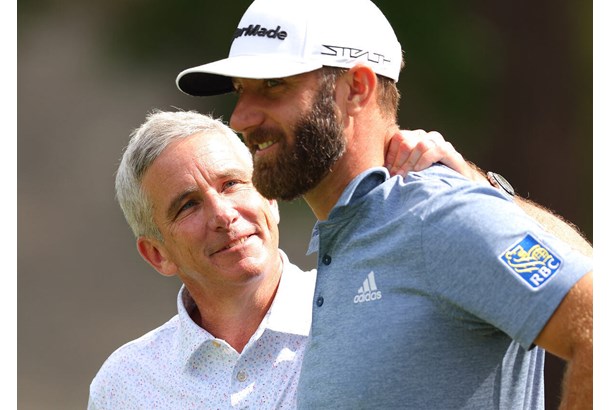 Happy times: Dustin Johnson and PGA Tour Commissioner Jay Monahan