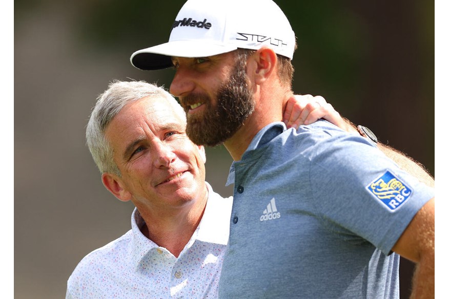 Happy times: Dustin Johnson and PGA Tour Commissioner Jay Monahan