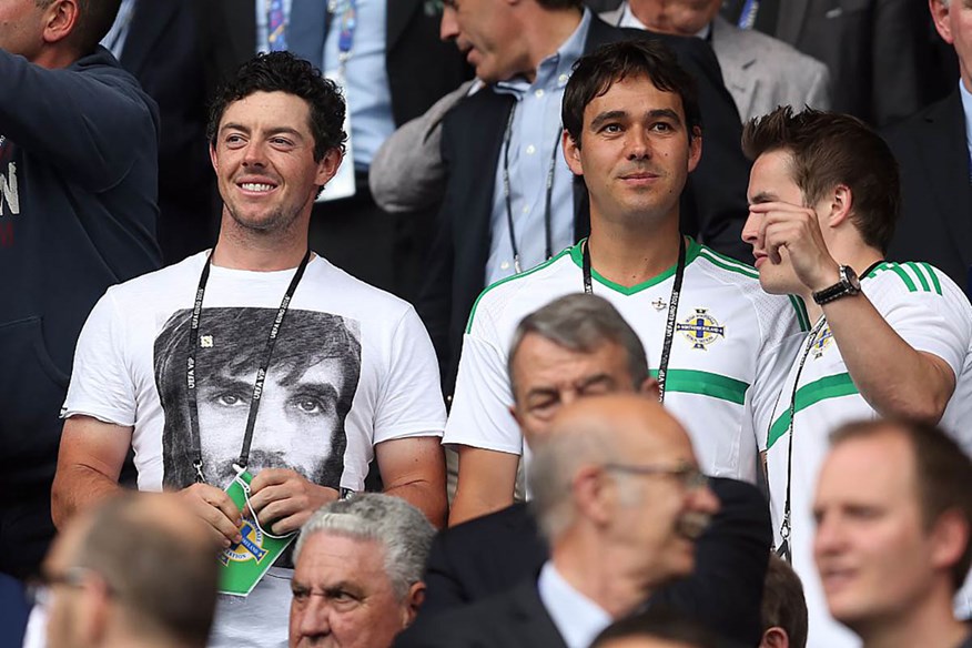 Rory McIlroy and caddie Harry Diamond watching Northern Ireland at Euro 2016.