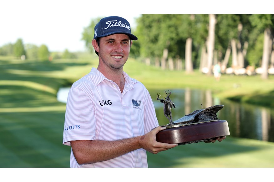 J.T. Poston with the John Deere trophy