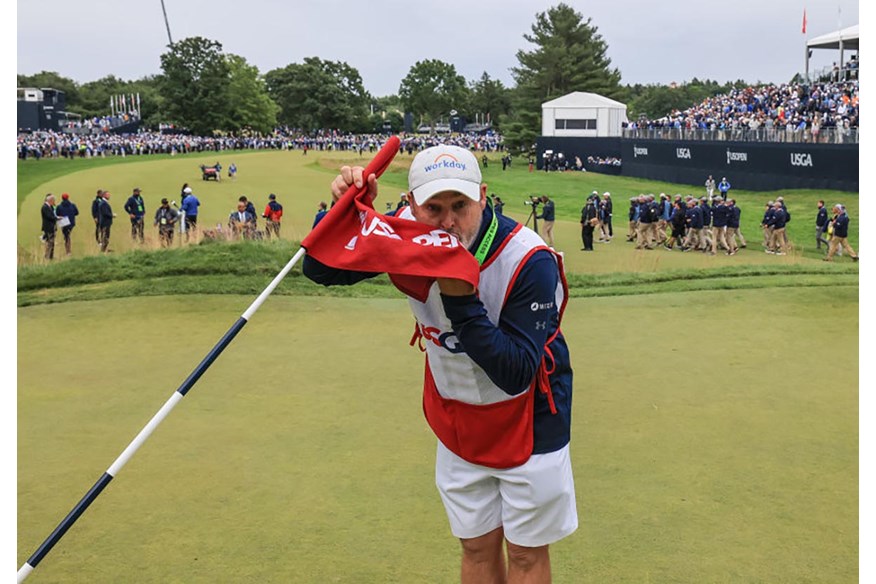 Billy Foster kisses the US Open's 18th hole flag at Brookline.