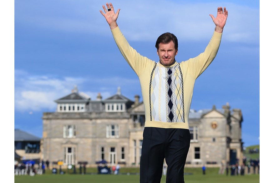 Sir Nick Faldo waves to the crowd as he stands on Swilcan Bridge during the second round of the 144th Open Championship at The Old Course St Andrews in 2015, his is last Open at the course.