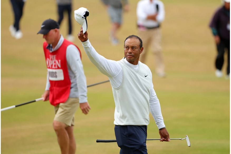 Tiger Woods waves to the crowds at the end of his second round at the 150th Open.