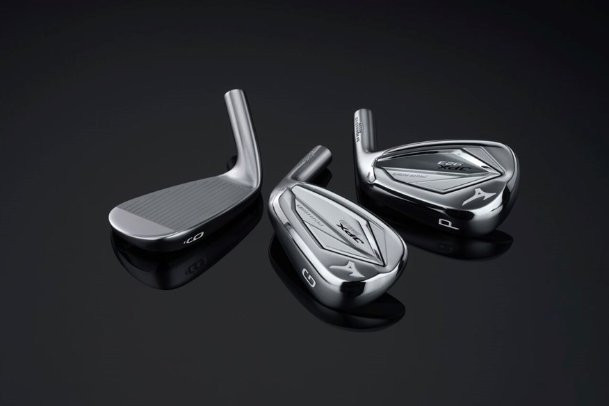 Three Mizuno JPX923 iron heads