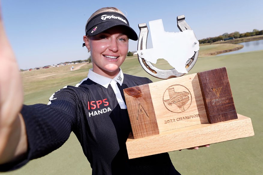 Charley Hull poses with The Ascendant LPGA Benefitting Volunteers of America trophy.