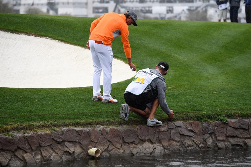 Unlike 2019, Rickie Fowler would no longer be punished if his placed golf ball rolled back into the water.