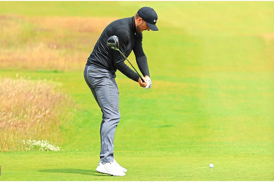 Harry Kane's golf swing as he prepares for impact.