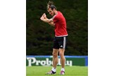 Gareth Bale checks his golf technique during Wales training.