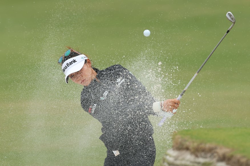 Lydia Ko playing out of a bunker.