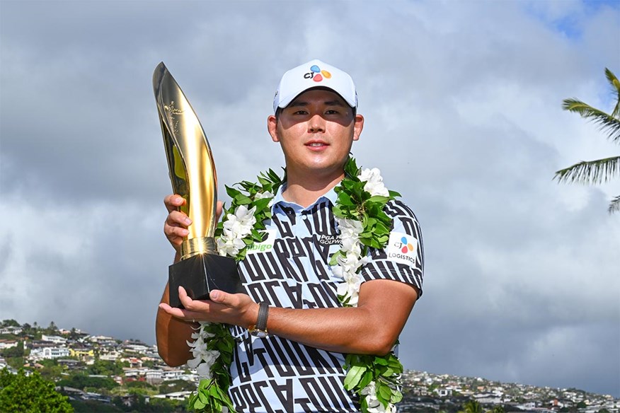 Si Woo Kim holding Sony Open trophy in Hawaii.