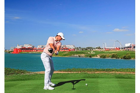 Rory McIlroy keeps the trail arm straight in his takeaway