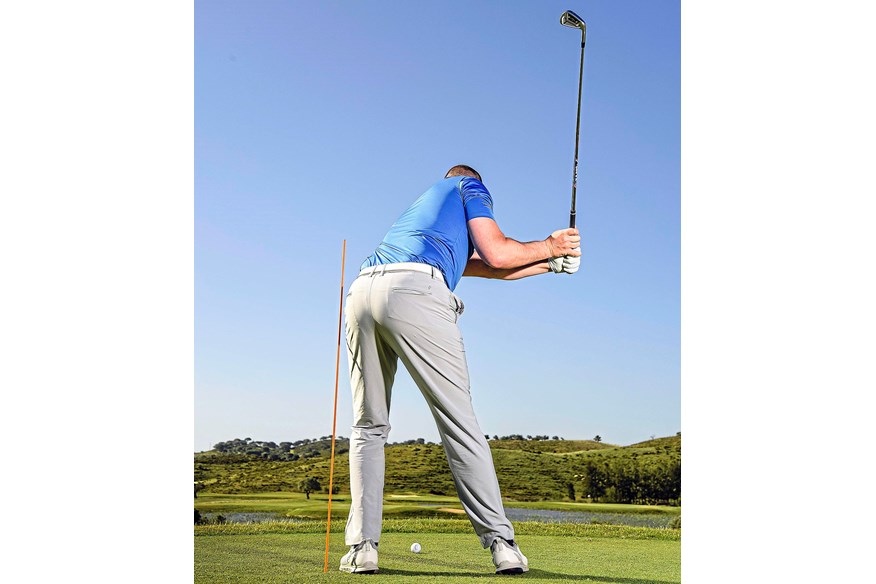 A good downswing starts with a slight lateral shift or hip bump