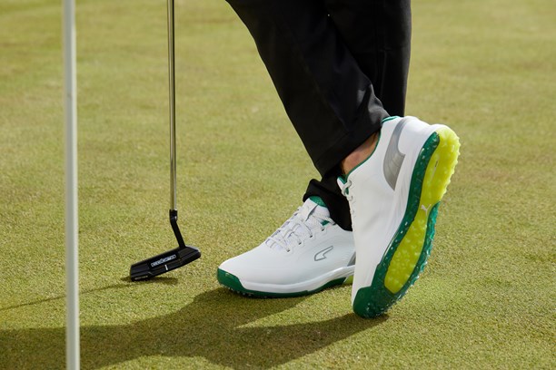 Puma Alphacat Nitro golf shoes on a green.