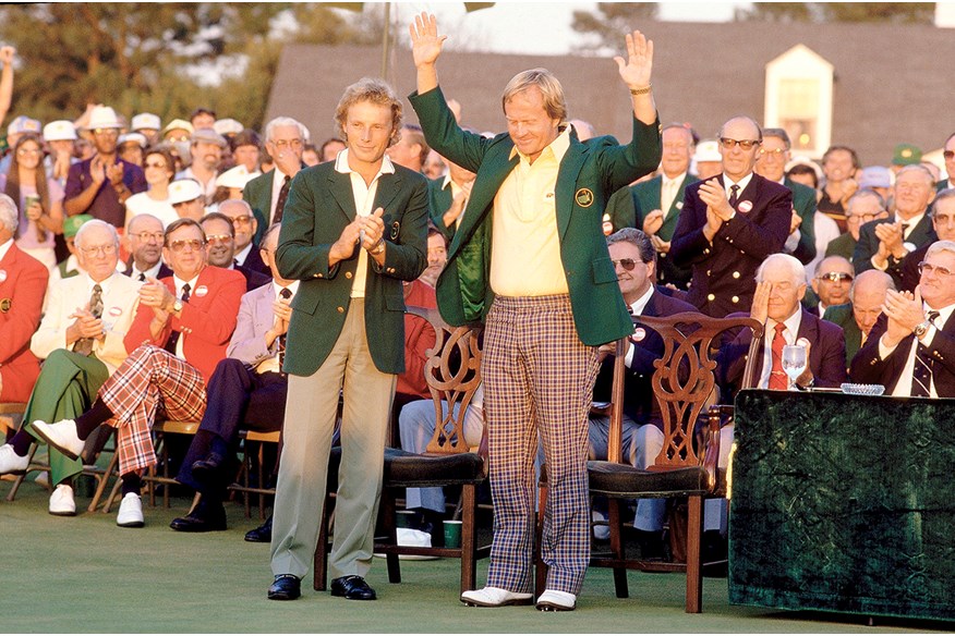 Jack Nicklaus receives the Green Jacket from previous winner Bernhard Langer after victory in the 1986 Masters