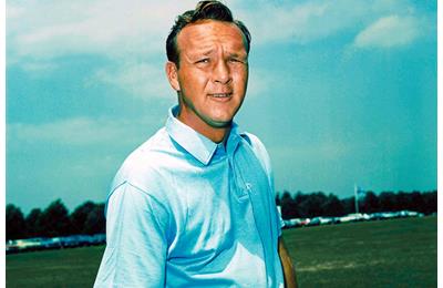 Arnold Palmer stops for a photograph during the 1964 Masters.