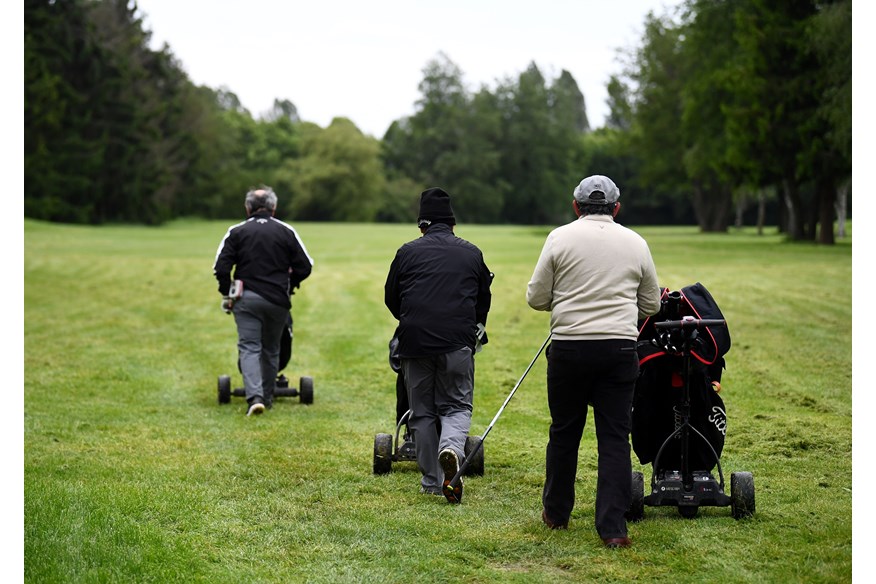 Golfers with electric carts