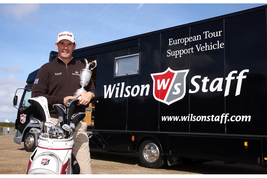 Padraig Harrington poses with the Claret Jug and his Wilson Staff golf clubs outside the brand's tour truck at Royal Birkdale in 2008.