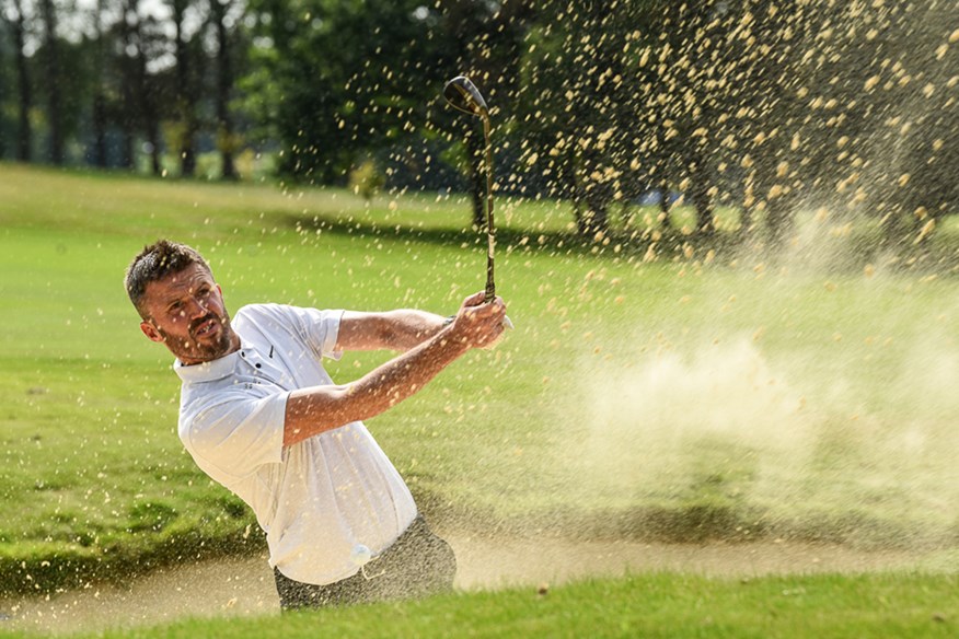 Michael Carrick splashing out of the bunker