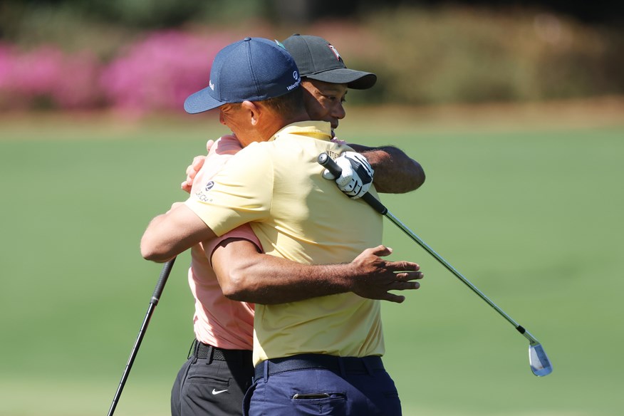 Billy Horschel and Tiger Woods embrace. Horschel plans to ask his friend to sign some items for his collection.