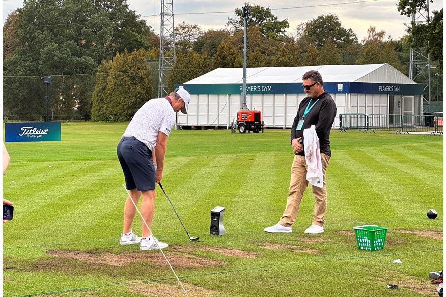 Justin Rose and caddie Mark 'Fooch' Fulcher working together on the range at the BMW PGA Championship at Wentworth.