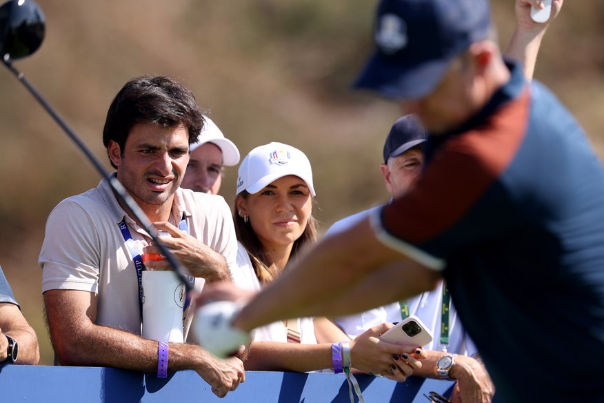 Carlos Sainz watches Rory McIlroy's Ryder Cup practice round.