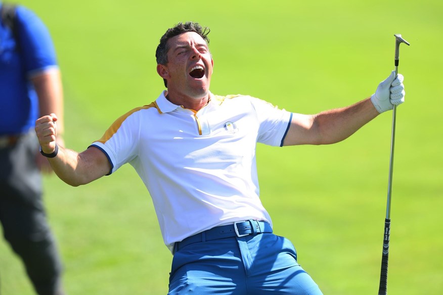 McIlroy celebrates holing out from the rough in practice at the Ryder Cup..