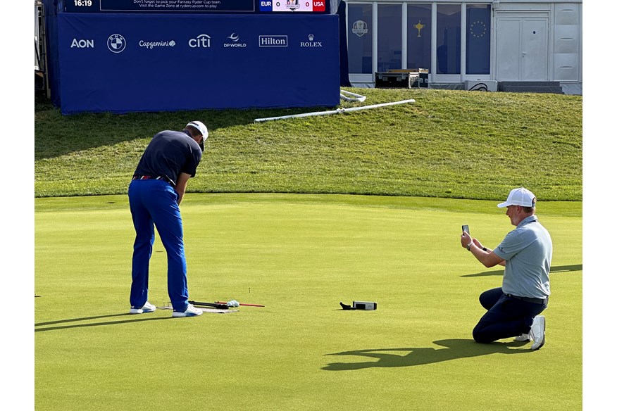 Scottie Scheffler working on his putting with Phil Kenyon at the Ryder Cup.