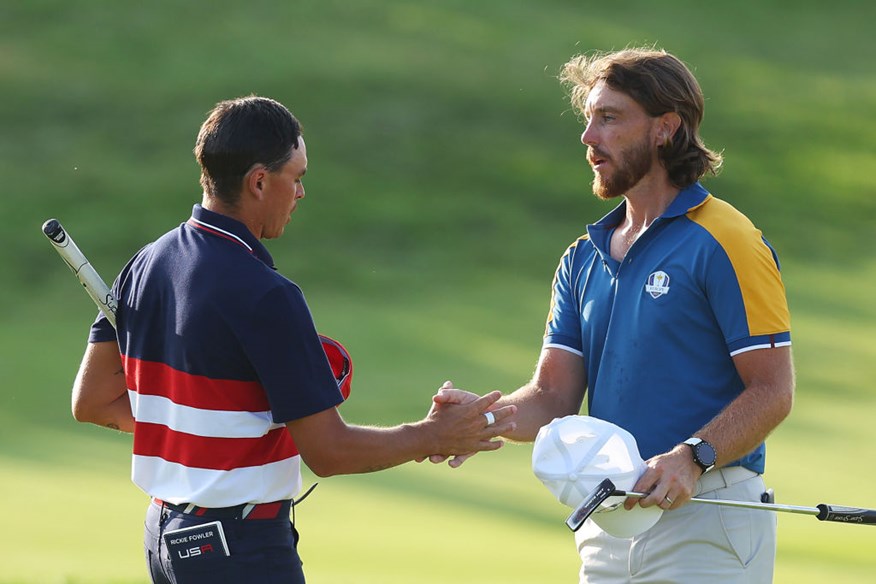 Rickie Fowler shakes Tommy's hand on the 17th green at Marco Simone to confirm Europe's Ryder Cup win.