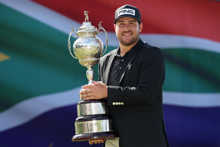 Thriston Lawrence lifts the 2022 Investec South African Open.