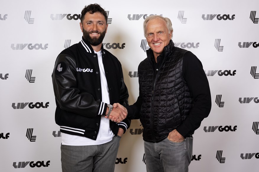 Jon Rahm shakes hands with LIV Golf CEO Greg Norman after agreeing to join the Saudi-backed tour and become the world's highest-paid athlete.