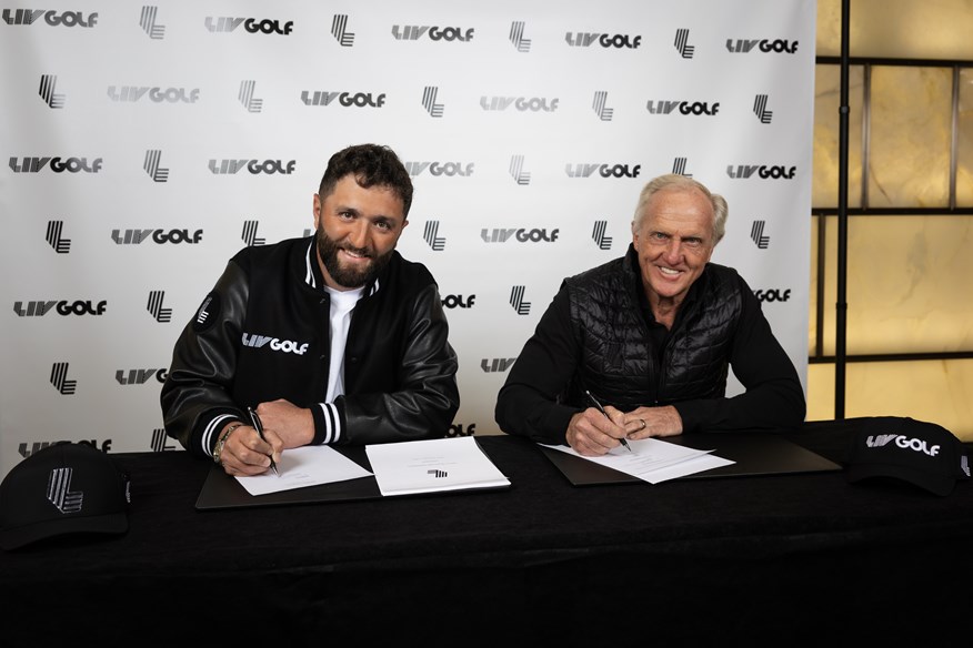 Jon Rahm finalizes his LIV Golf contract with CEO Greg Norman.