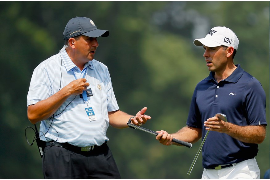 Charl Schwartzel reacts after breaking an iron during the 2016 PGA Championship.