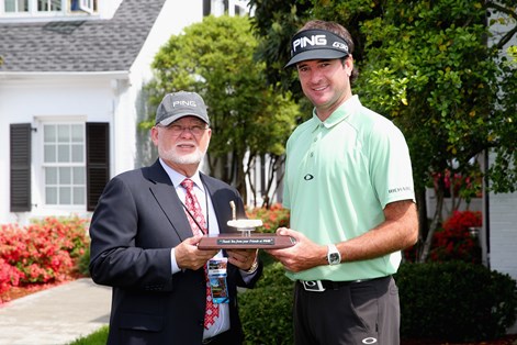 Bubba Watson was presented with a gold putter by Ping President John Solheim.