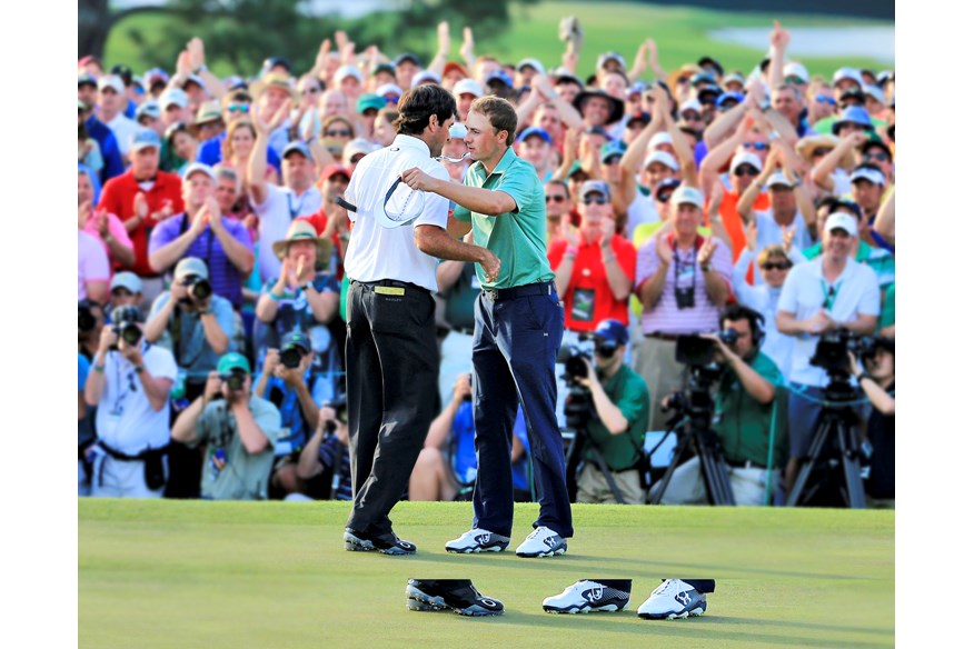 Bubba Watson commiserating Jordan Spieth at the 2014 Masters.