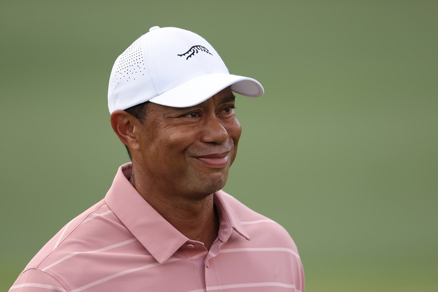 A smiling Tiger Woods during the opening round of the 2024 Masters.