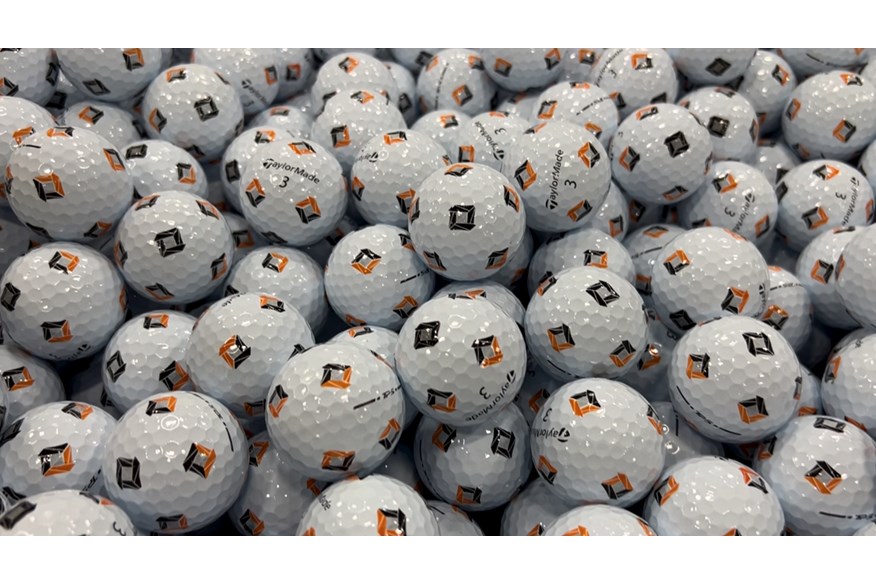 Hundreds of TaylorMade TP5 Pix golf balls waiting to be boxed