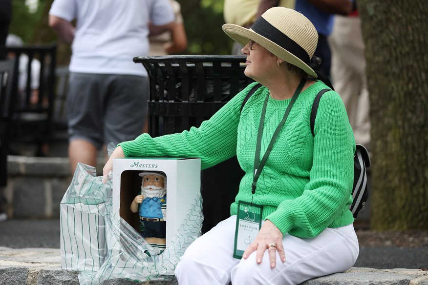 Lady at Augusta Protecting her Masters Gnome in 2023