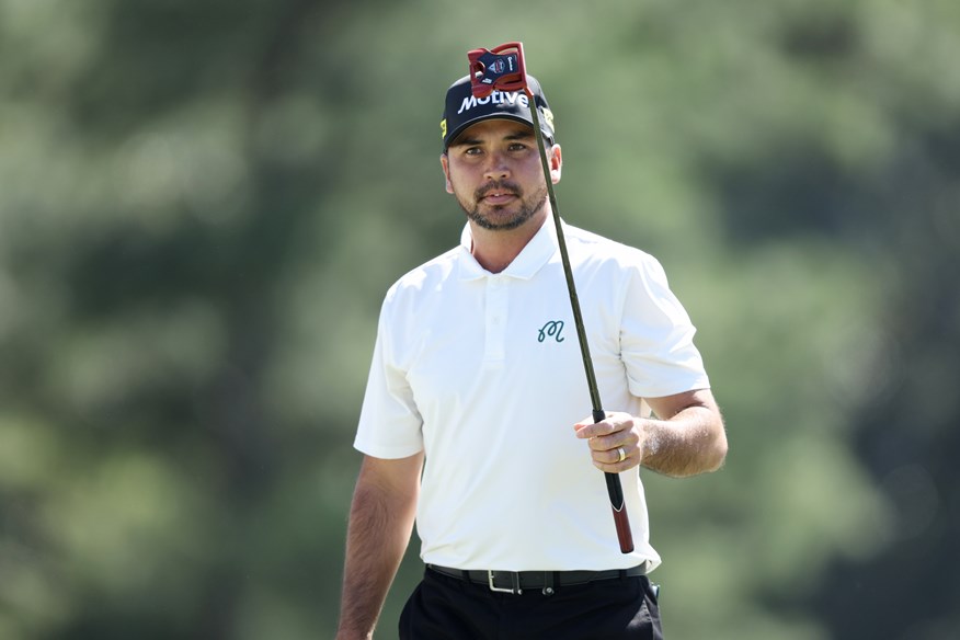 The sweater vest had gone by the time Day teed off for round two.