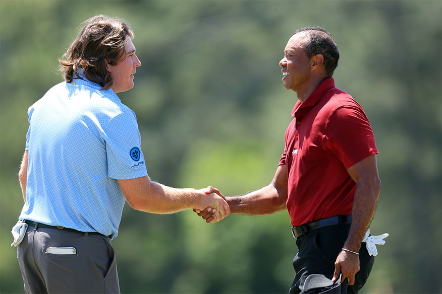 Neal Shipley and Tiger Woods exchange hand shake on the 18th green after there final round.