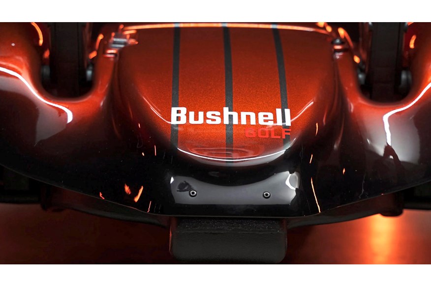 The bespoke Stewart Golf X10 Follow has Bushnell colours and branding.