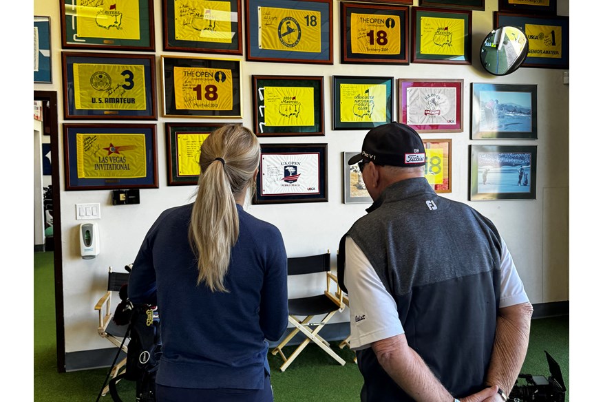 Iona Stephen and Butch Harmon cast an eye over the flags of all the victories he's coached players to.