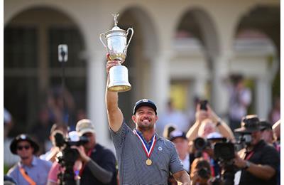 Bryson DeChambeau lifts the US Open trophy after his second major win