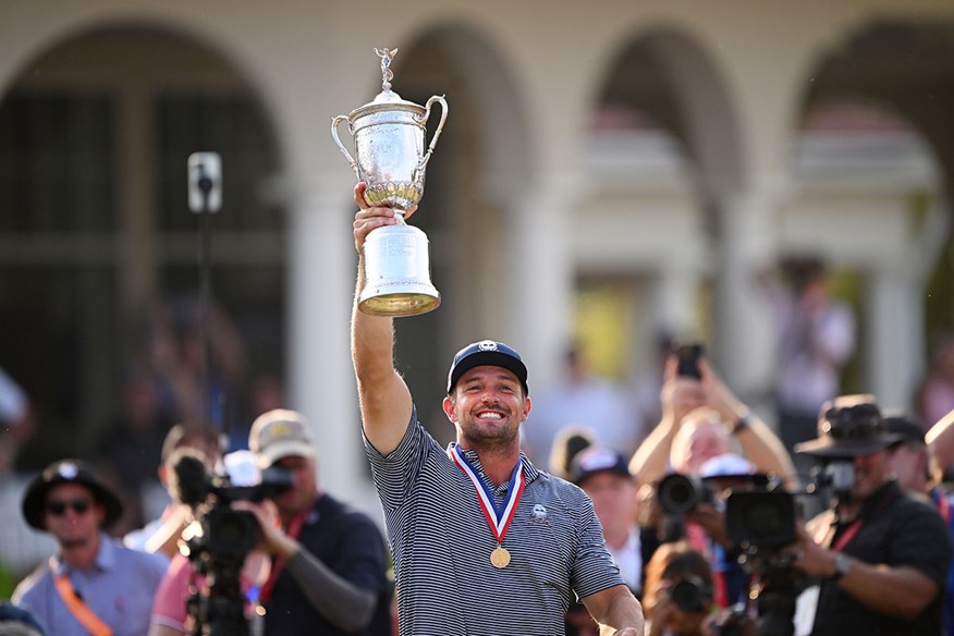 Bryson DeChambeau lifts the US Open trophy after his second major win