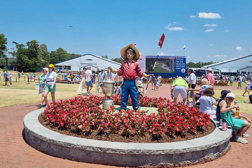 A huge statue of Putter Boy in the US Open fan zone at Pinehurst